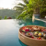Chef serving sunset dinner at an ocean-view villa in Cemagi, Tabanan, Bali