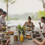 Private chef preparing a sunset dinner at a clifftop Balangan villa above the Indian Ocean