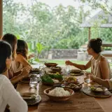 Private chef serving a fresh seafood dinner at a Candidasa beachfront villa in East Bali
