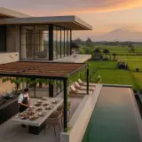 Chef preparing a romantic dinner at a secluded design villa in Pererenan at dusk